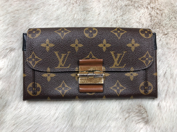 LOUIS VUITTON ELYSEE MONOGRAM WALLET, with gold tone clasp at the