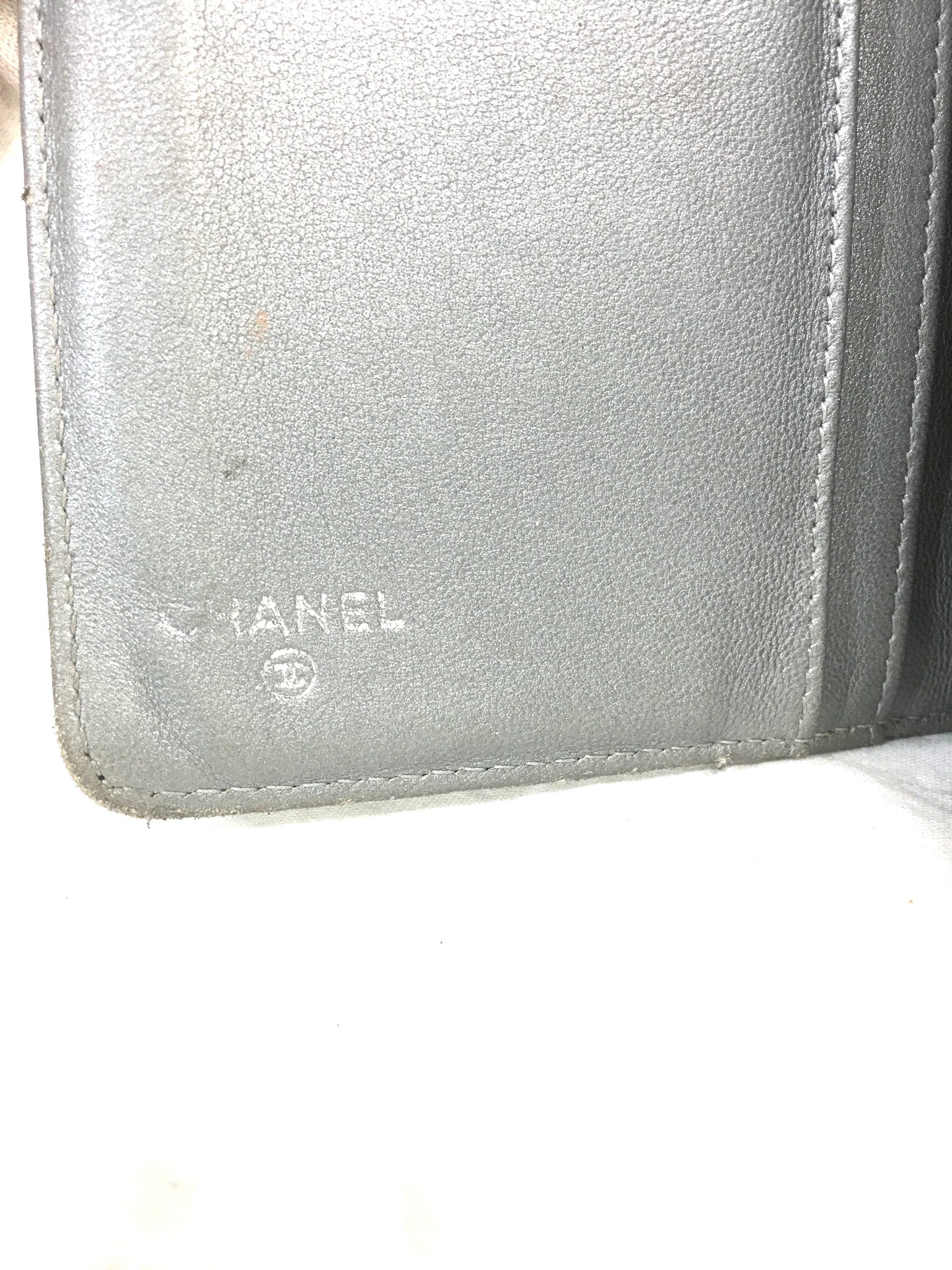 CHANEL Lambskin Camellia Embossed Black Wallet