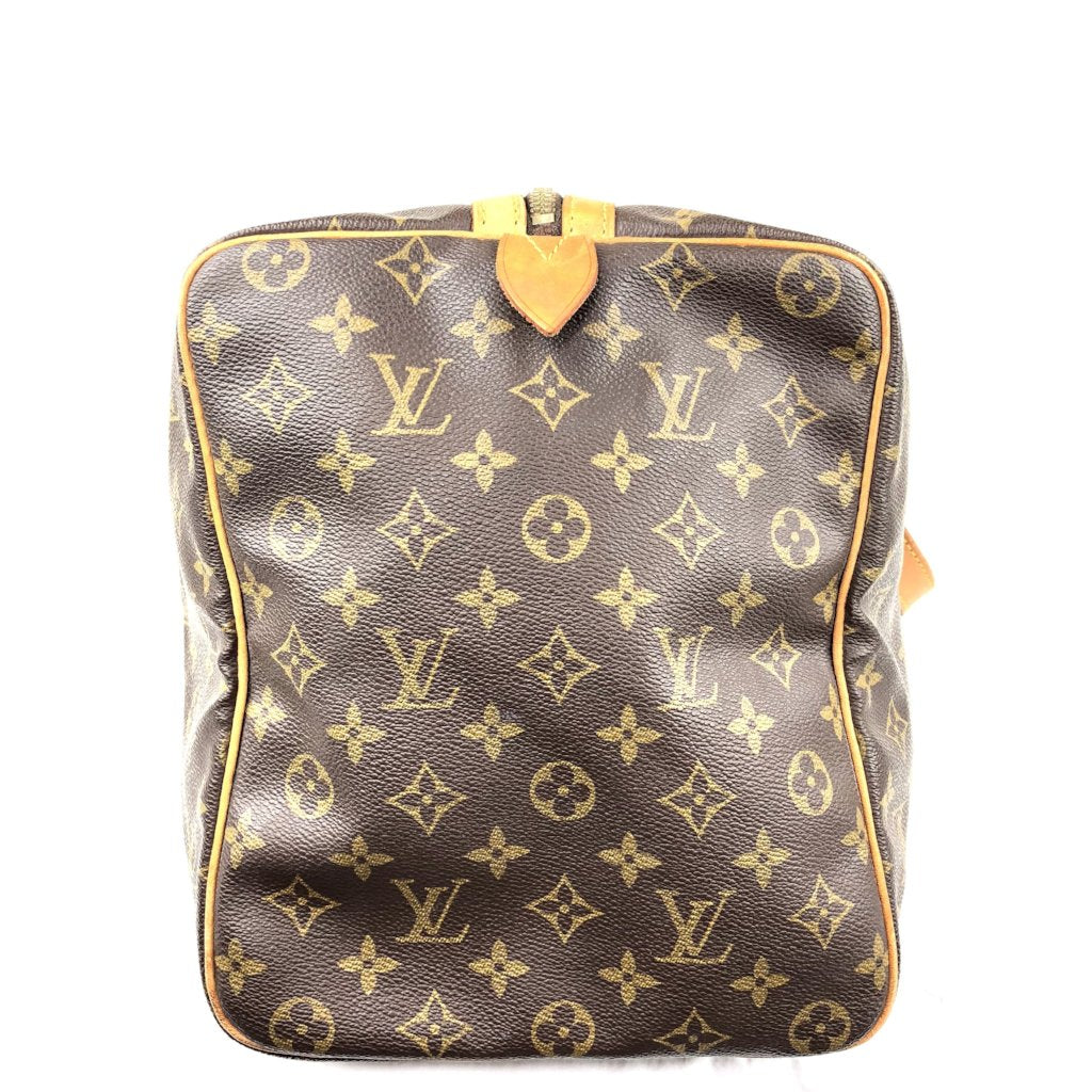 Sold at Auction: Louis Vuitton Sac Souple 45 Travel Bag, in a monogram  coated canvas, with vachetta leather accents and golden brass hardware, in  a b